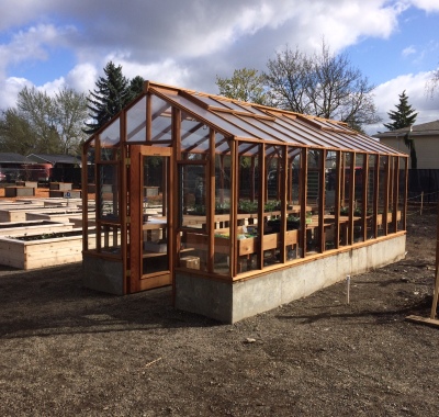 9x20 Deluxe Glass-to-Ground with two jalousie windows and Full Lite door on 18" high concrete base wall