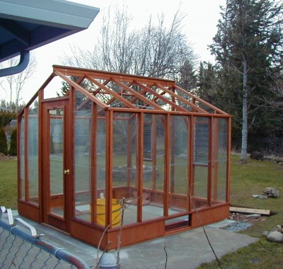 9x9 Deluxe Glass-to-Ground with two jalousie windows in back end wall and Full Lite door on 9.5" high Sturdi-Built base wall