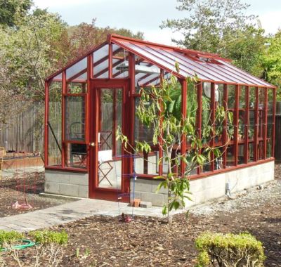 Side view of 9x14 Deluxe Glass-to-Ground with two jalousie windows and Full Lite door on 18" high block base wall
