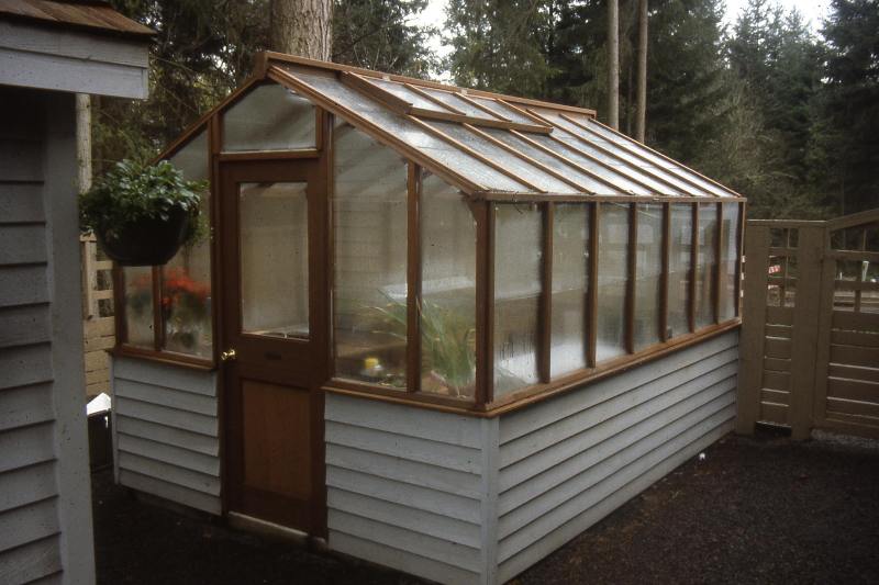 Traditional greenhouse on white base