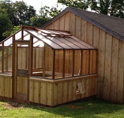 Redwood greenhouse attached to a shed