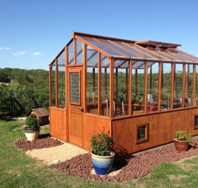 Redwood greenhouse Texas with twin wall roof