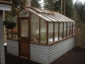 Traditional greenhouse on white base