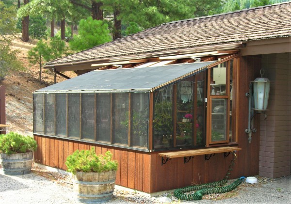 8x14 Deluxe Regular Lean-to tucked underneath eave with shade cloth on roof and walls