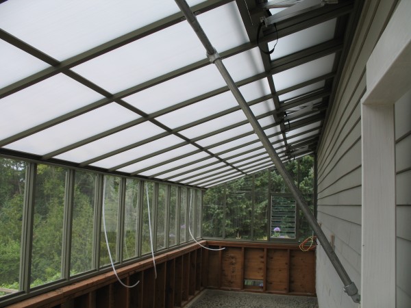 Interior of 8x24 Deluxe Regular Lean-to with White Twin Wall Thermal Option and pipe bracing for roof support