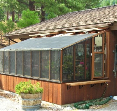 8x14 Deluxe Regular Lean-to tucked underneath eave with shade cloth on roof and walls