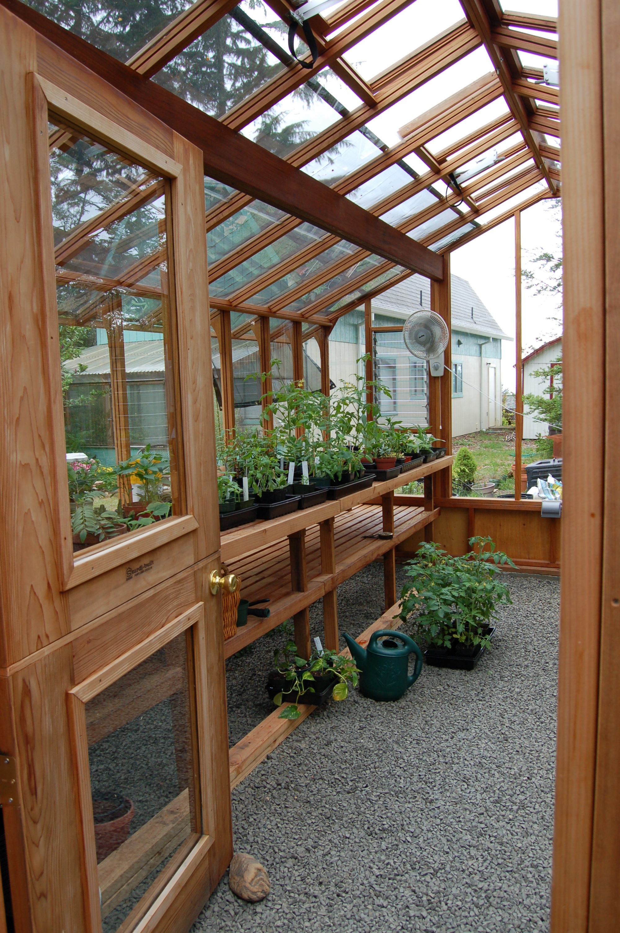 Interior of 12x16 Garden Deluxe with Dutch door option and two-tier benches
