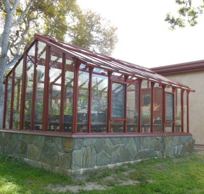 Redwood & glass greenhouse in Salinas CA from the back