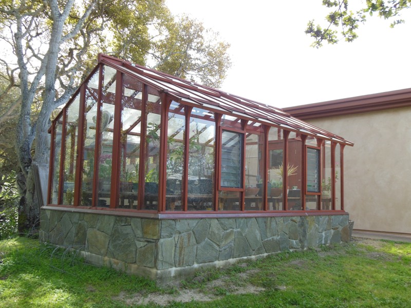 Redwood & glass greenhouse in Salinas CA from the back