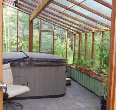 Interior of 9x18 Garden Sunroom greenhouse with hot tub
