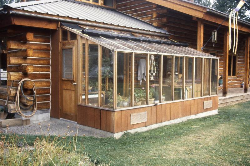 8x16 Garden Sunroom greenhouse attached to a log cabin