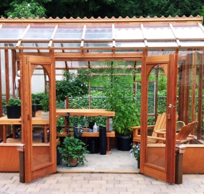 Redwood greenhouse with sitting area