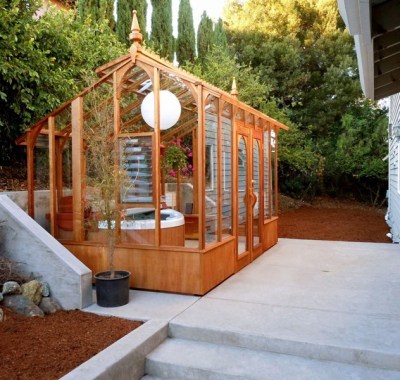Tall glass greenhouse with Spa inside