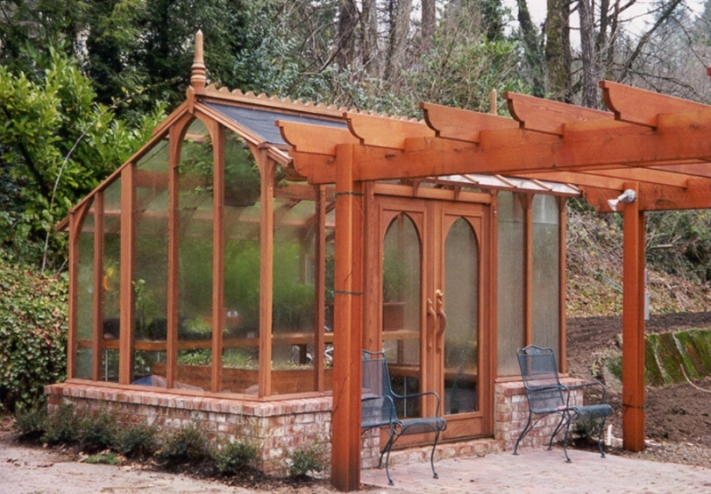 Greenhouse with arbor in front