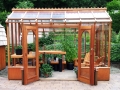 Redwood greenhouse with sitting area
