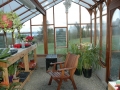 Greenhouse interior showing roof beams and twin wall roof