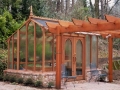 Greenhouse with arbor in front