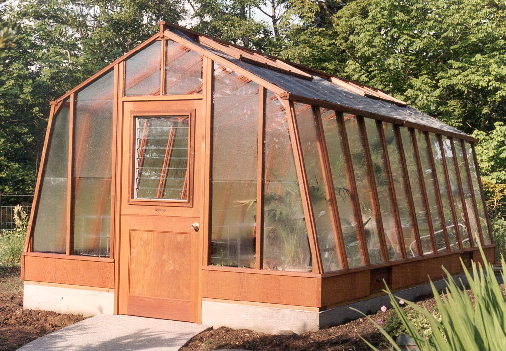 11x20 Solite redwood greenhouse with Jalousie window in the door and shade cloth on the roof