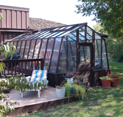 11ft wide Solite home greenhouse with one end attached to the house