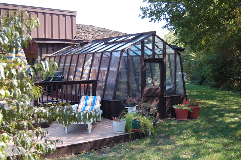 11ft wide Solite home greenhouse with one end attached to the house