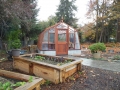Redwood greenhouse with concrete base wall