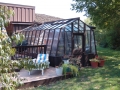 11ft wide Solite home greenhouse with one end attached to the house