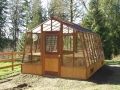 11x18 Solite garden greenhouse set on a 18" Sturdi-Built wood base wall