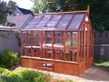 Trillium home greenhouse with shade cloth