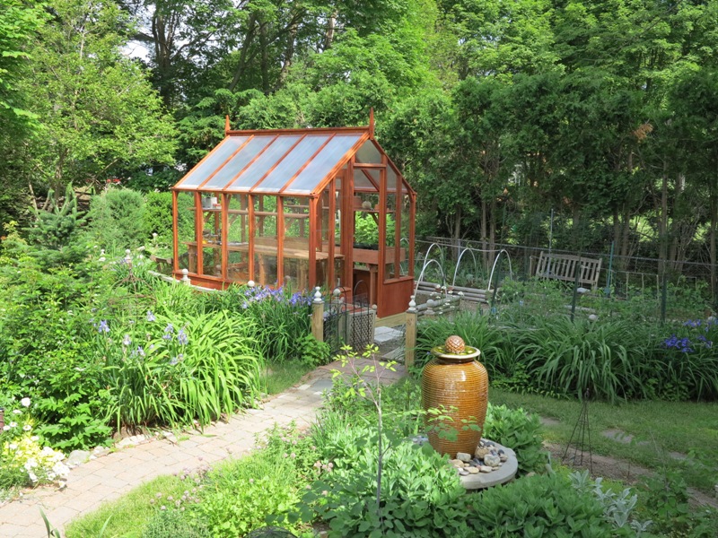 Small home greenhouse in a garden