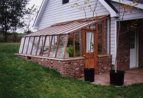 Redwood greenhouse built into ground