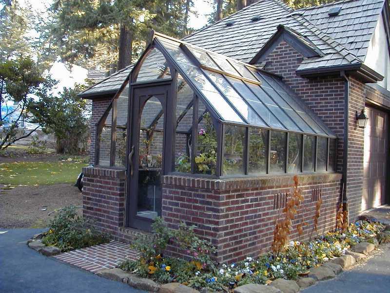 Tudor redwood greenhouse, attached at gable end and stained brown
