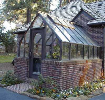 Tudor redwood greenhouse, attached at gable end and stained brown