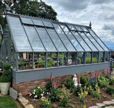 Side view of 10x18 Tudor greenhouse with beautiful view overlooking Willamette Valley, OR
