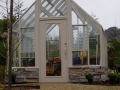 Custom Tudor Glass Greenhouse on shorter base wall